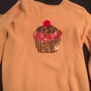 Cupcake sweater with light up cherry on top